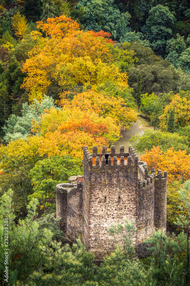 Lousã castle seen from the viewpoint, with trees with autumn colors in the background, in Lousã, Portugal.