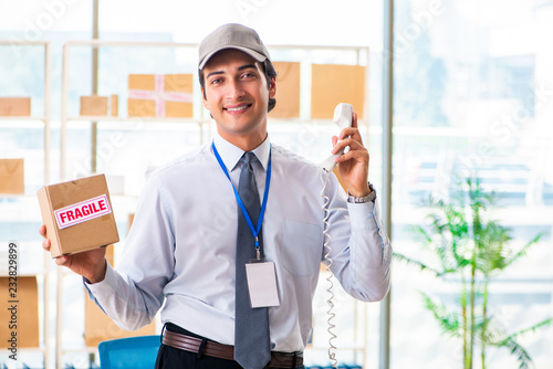 Wallpaper Mural Male employee working in box delivery relocation service Torontodigital.ca