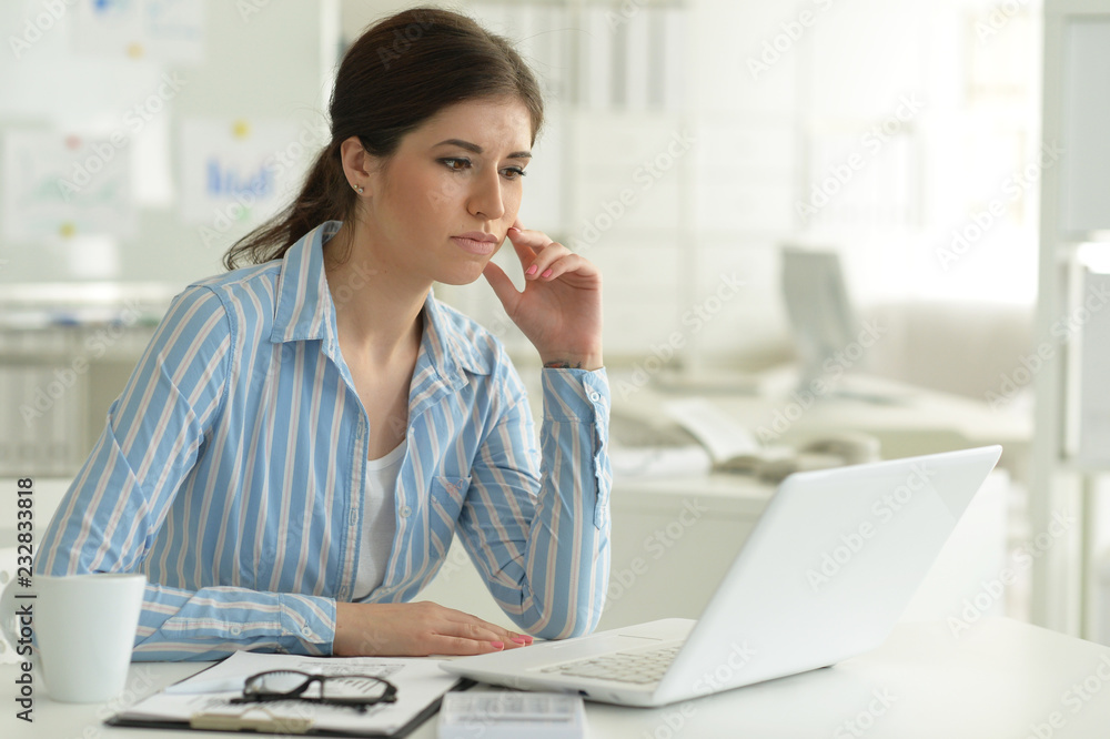 Portrait of a young attractive woman working Portrait of a young attractive woman working
