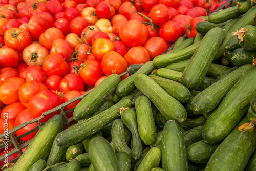 fresh cucumbers and tomatoes at the market
