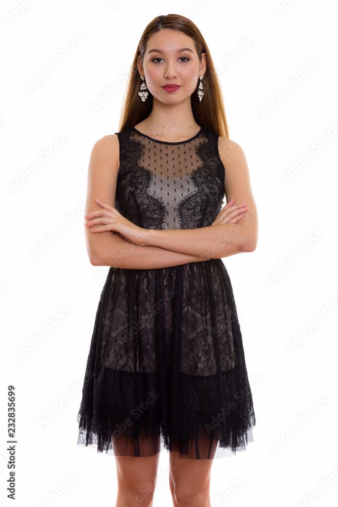 Studio shot of young beautiful Asian woman standing with arms cr Studio shot of young beautiful Asian woman standing with arms cr