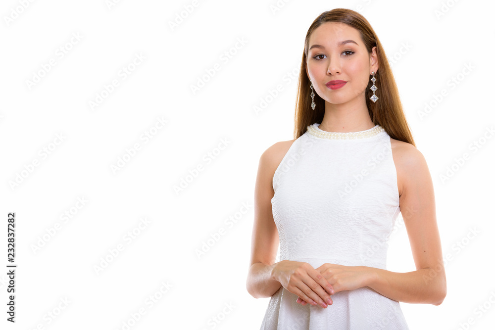 Studio shot of young beautiful Asian woman with hands together Studio shot of young beautiful Asian woman with hands together