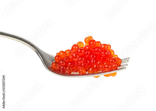 Red caviar on metal fork isolated over white background