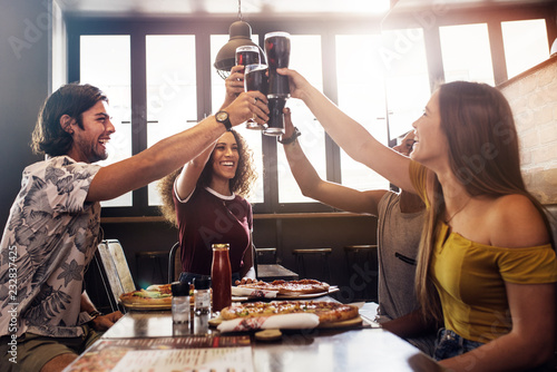 Sticker Group of friends making a toast at restaurant