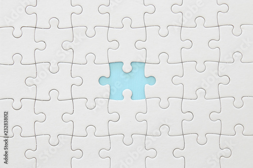 background of white puzzle with missing piece.