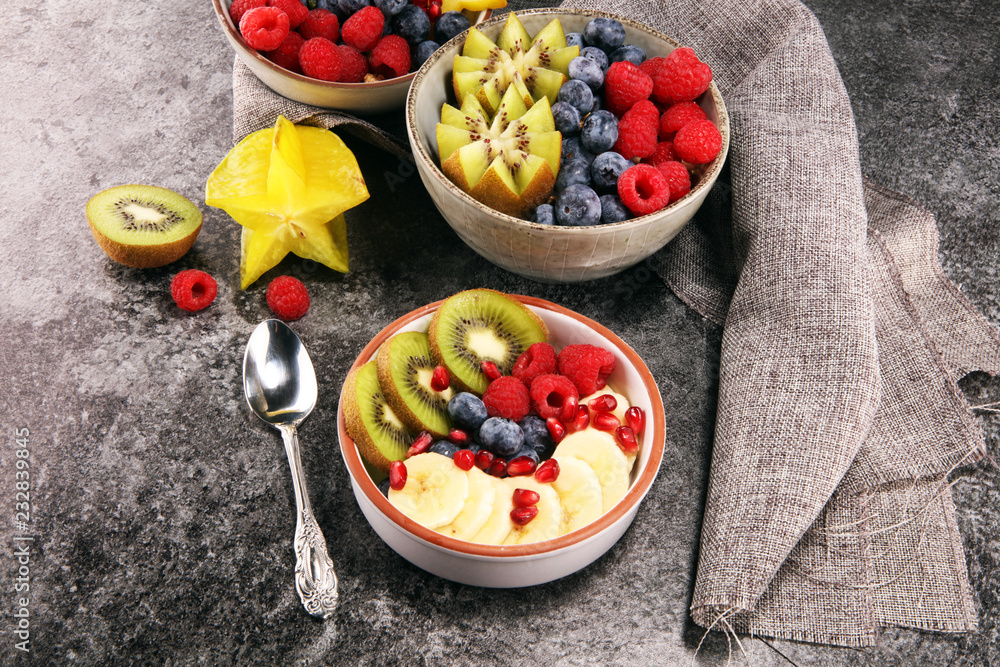 fruit bowl. Bowl of healthy fresh fruit salad on rustic background fruit bowl. Bowl of healthy fresh fruit salad on rustic background