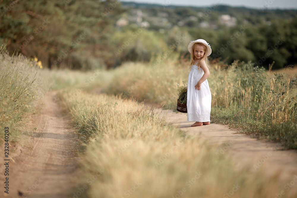 Girl in a field with flowers in their hands Girl in a field with flowers in their hands