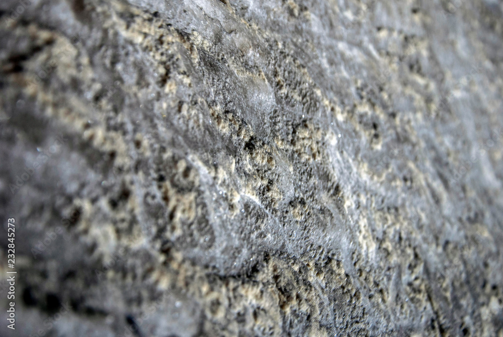 Gray texture of natural. Raw salt in an underground salt mineRock salt.