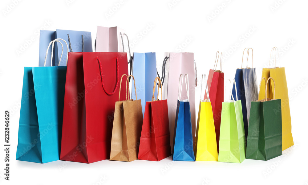 Colorful paper shopping bags on white background