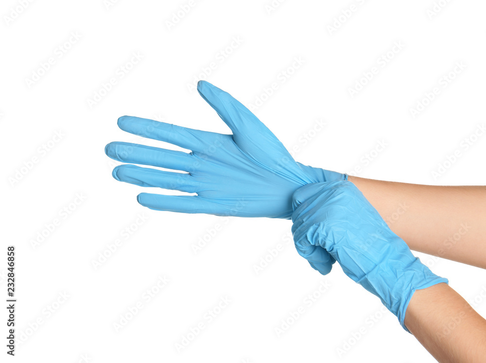 Doctor wearing medical gloves on white background