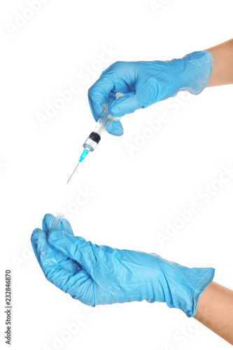 Doctor in medical gloves holding syringe on white background