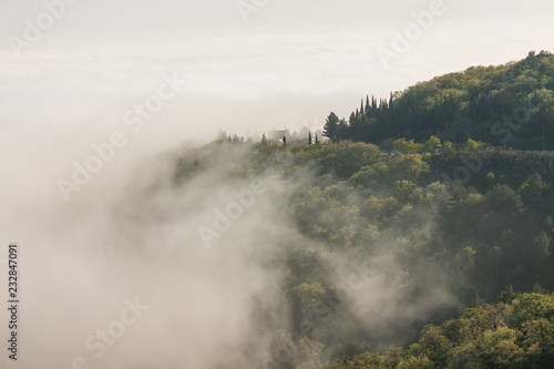 Picturesque road and heavy fog in the mountains of Crimea.