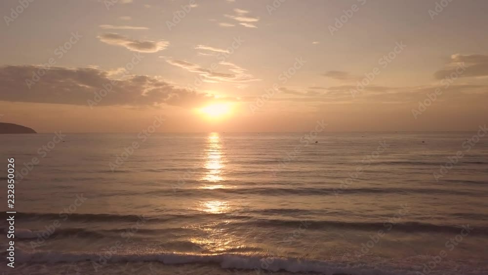 Morning sunrise over sea water on summer beach drone view. Colorful sunrise in morning sky and sea, ship sailing background, aerial landscape. Morning sunrise over sea water on summer beach drone view. Colorful sunrise in morning sky and sea, ship sailing background, aerial landscape.