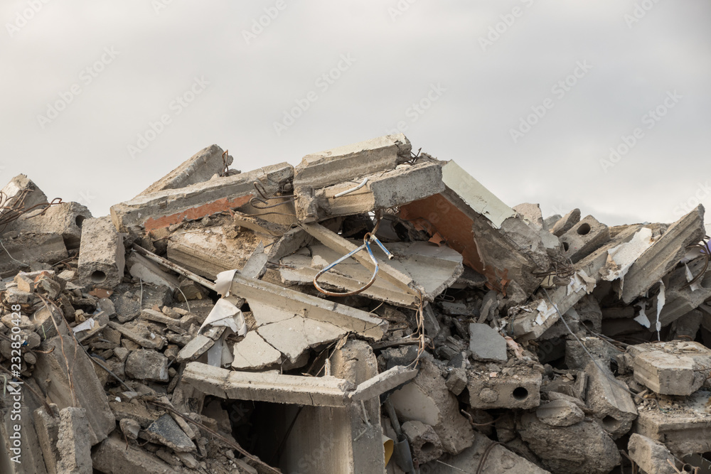 destroyed building - concrete and metal debris of a destroyed building - destroyed building