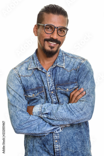 Young happy Indian man smiling studio portrait against white background