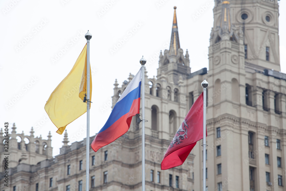 Fototapeta premium Russian flags on building background