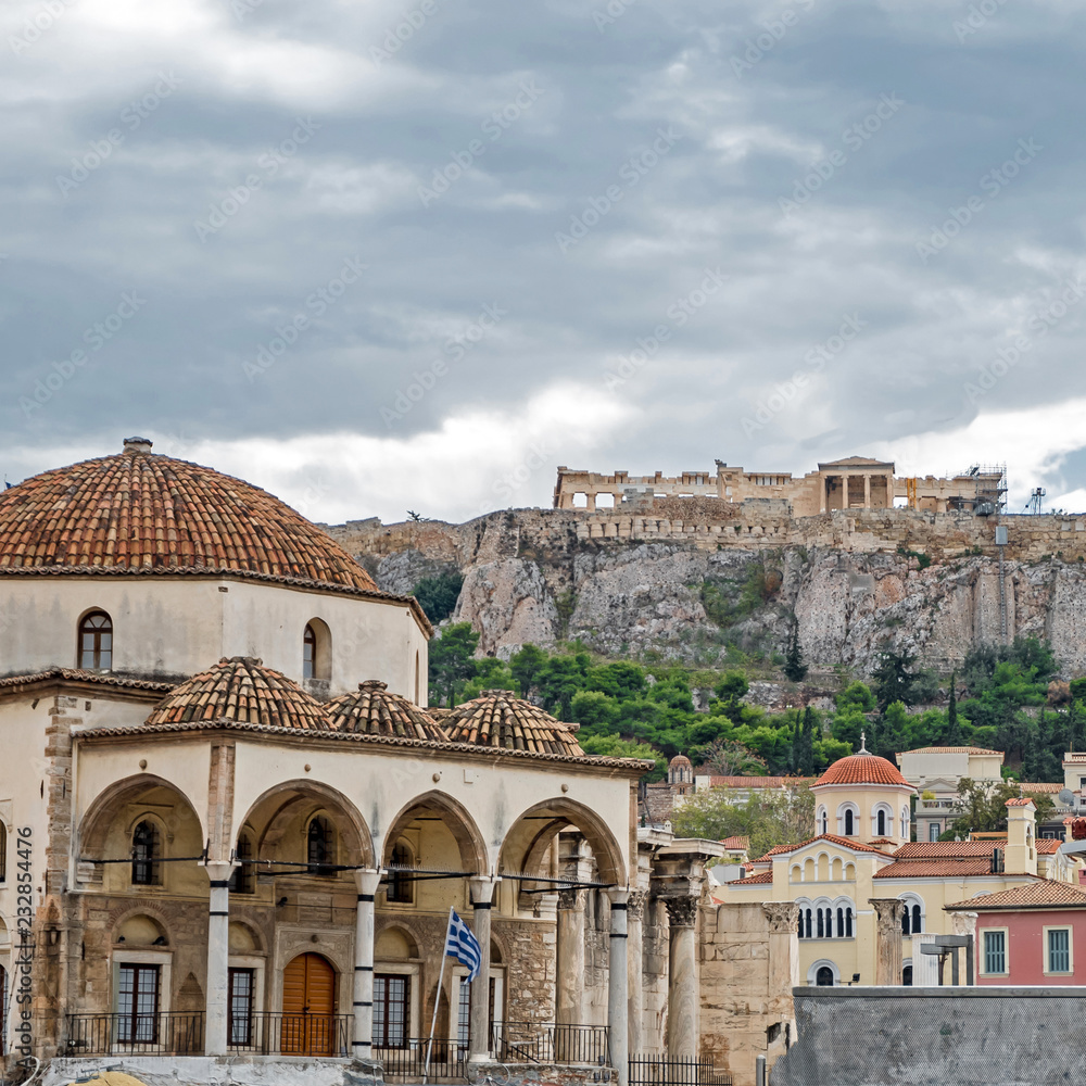 clouds over Athens Greece, tzistarakis mosque on monastiraki square under acropolis hill