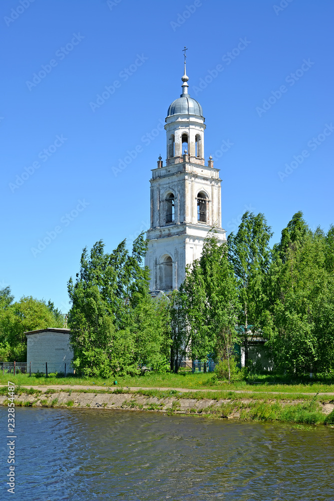 The belfry of Holy Trinity Cathedral (the 18th century) on the river bank of Pertomki. Poshekhonje, Yaroslavl region