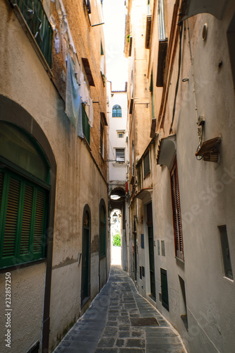 Narrow street in the old town in Italy © Leonid