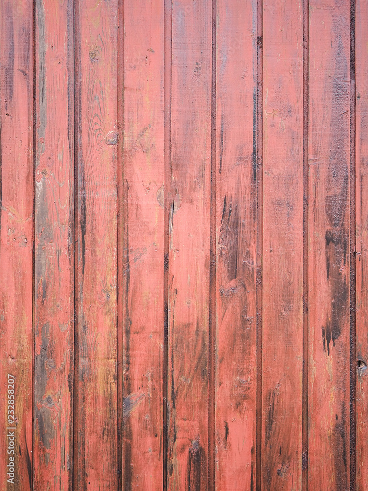 Close-up of old red wooden planks wall texture. Vintage style, rustic wood texture with natural patterns surface as background. Vertical layout. High-quality macro photography. Close-up of old red wooden planks wall texture. Vintage style, rustic wood texture with natural patterns surface as background. Vertical layout. High-quality macro photography.
