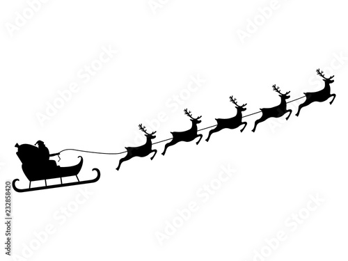 Santa Claus rides in a sleigh in harness on the reindeer 