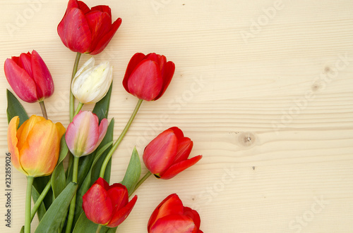 Tulips on a light wooden background. romantic picture.  