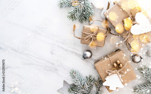 Christmas and New Year holiday background. Xmas greeting card. Christmas gifts on white marble background top view. Flat lay