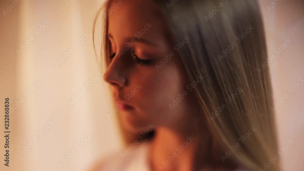 Close up face little girl with a make-up looks out of the way serious stand indoors cute portrait young attractive blonde hair beautiful caucasian female pretty slow motion Close up face little girl with a make-up looks out of the way serious stand indoors cute portrait young attractive blonde hair beautiful caucasian female pretty slow motion