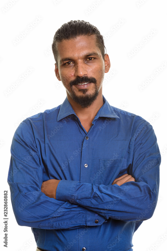 Young happy Indian businessman smiling studio portrait against white background