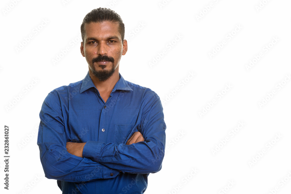 Obraz premium Young Indian businessman studio portrait against white background