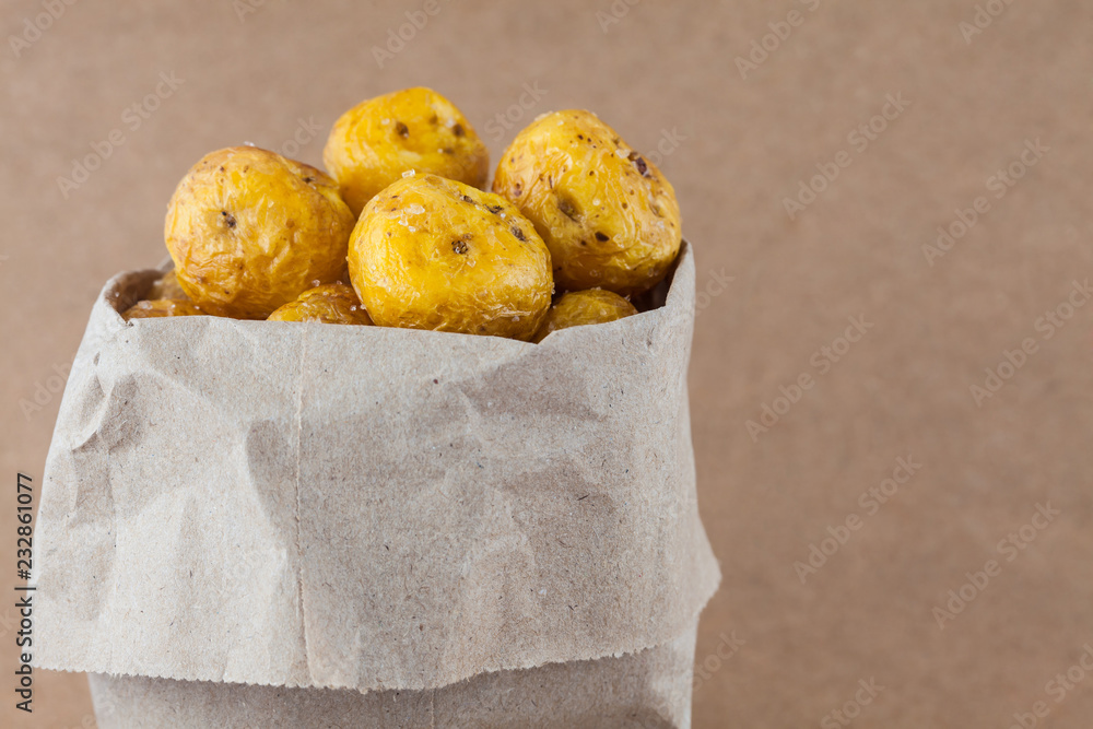 Fried yellow potato (Solanum phureja) isolated in beige background ...