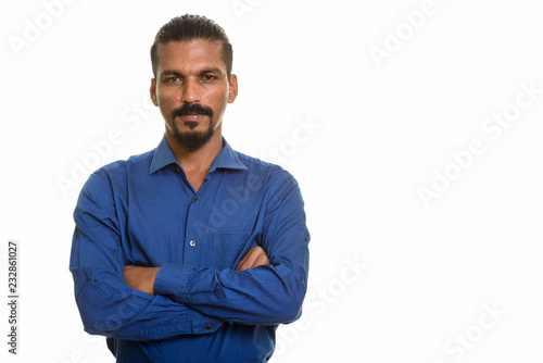 Young Indian businessman studio portrait against white background © Ranta Images
