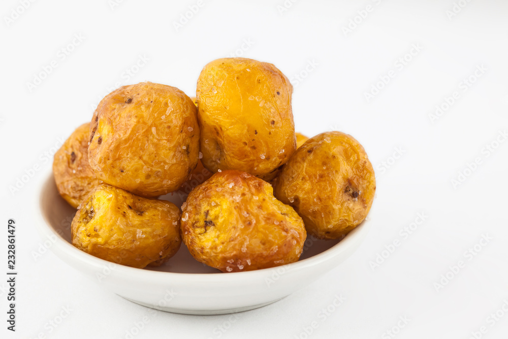 Fried yellow potato (Solanum phureja) isolated in white background