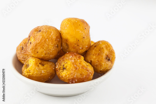 Fried yellow potato (Solanum phureja) isolated in white background