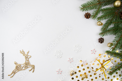 Christmas mockup flat lay styled scene with christmas tree, deer and decorations. Copy space photo