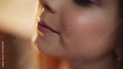 Close up view of cute pink lips of young girl talk speak smile feel happy beautiful child baby face kid mouth portrait hair young communication dialogue cute pretty slow motion