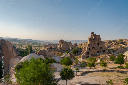 Detail from the structure of Cappadocia. Impressive fairy chimneys of sandstone in the canyon near Cavusin village, Cappadocia, Nevsehir Province in the Central Anatolia Region of Turkey. Clear sky.