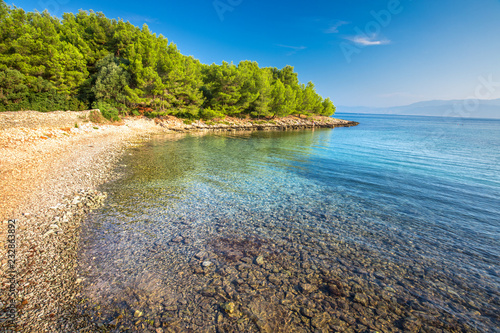 Fototapeta Naklejka Na Ścianę i Meble -  Pebble beach on Brac island with turquoise clear ocean water, Supetar, Brac, Croatia