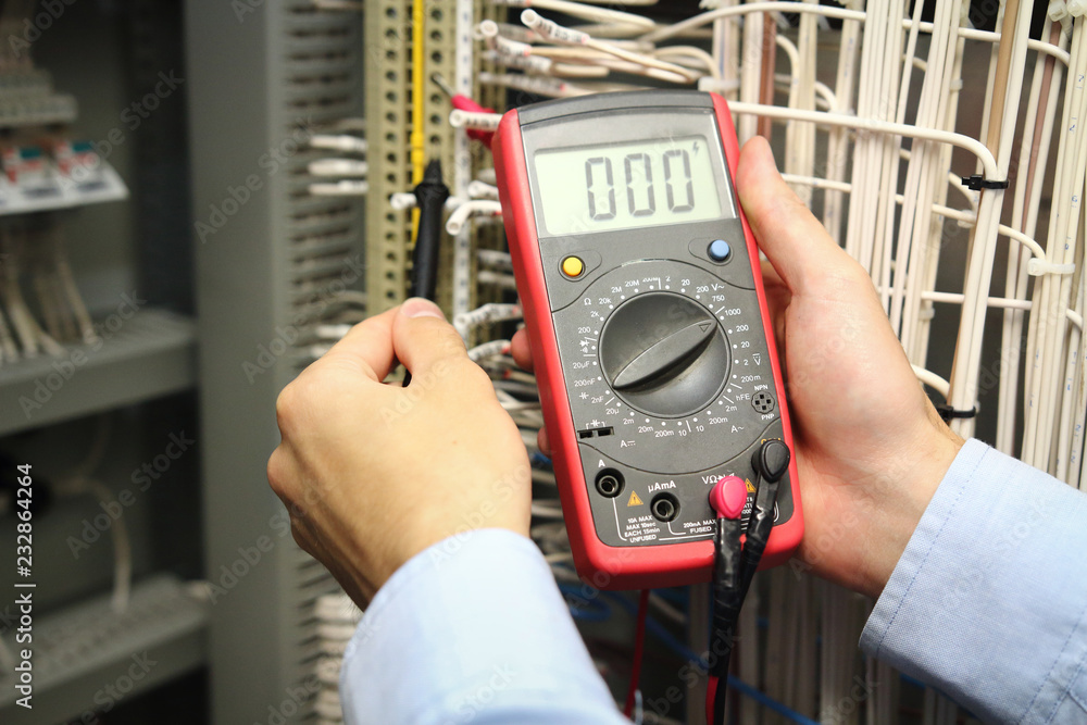 electrician measurements with multimeter tester.