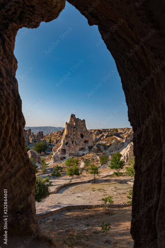 A slope detail  from the structure of Cappadocia. Impressive fairy chimneys of sandstone in the canyon near Cavusin village, Cappadocia, Nevsehir Province in the Central Anatolia Region of Turkey. 