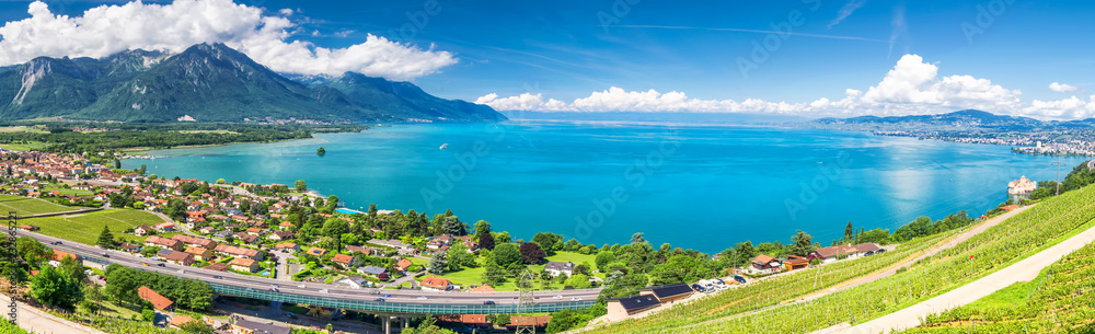 Obraz premium Panorama view of Montreux city with Swiss Alps, lake Geneva and vineyard on Lavaux region, Canton Vaud, Switzerland, Europe