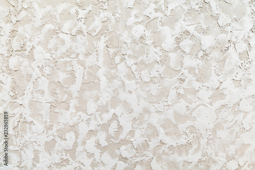 Beige wall with white decorative relief stucco