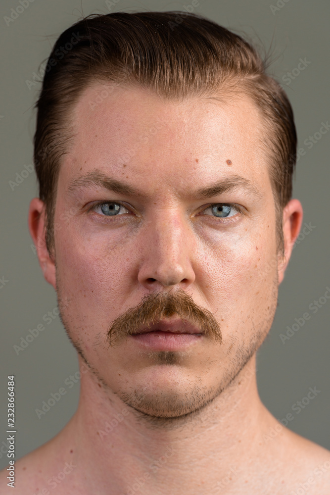 Face of young Caucasian man with mustache shirtless Face of young Caucasian man with mustache shirtless
