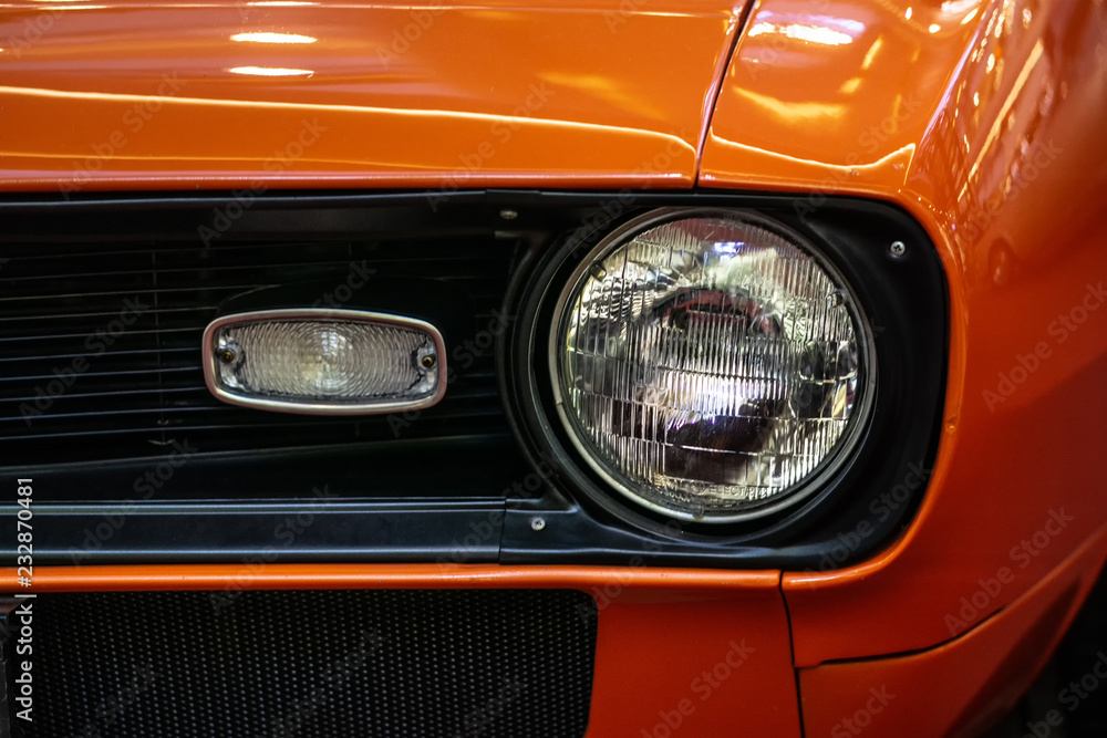 orange car headlight detail