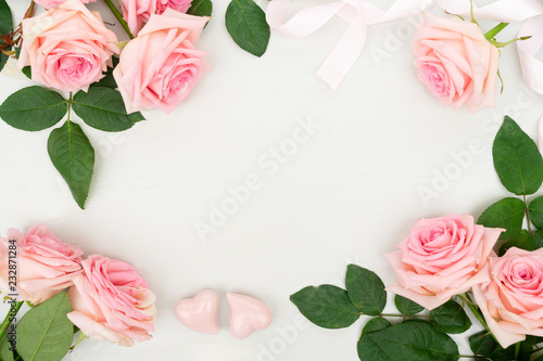 Rose fresh flowers frame for Valentines Day on table from above with copy space  flat lay scene