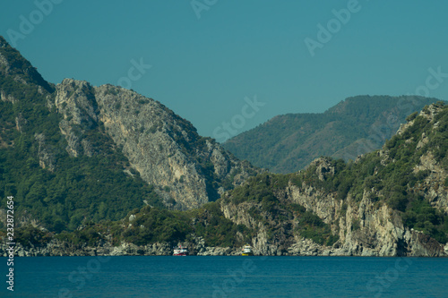Mountain and sea. coastline with overgrown rocks