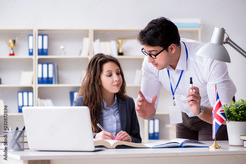 Teacher explaining to student at language training Teacher explaining to student at language training