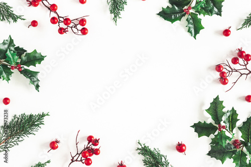 Christmas composition. Frame made of christmas plants on white background. Flat lay, top view, copy space
