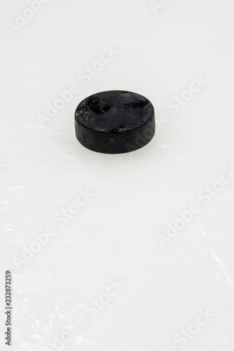 Puck on ice hockey rink surface  sport background