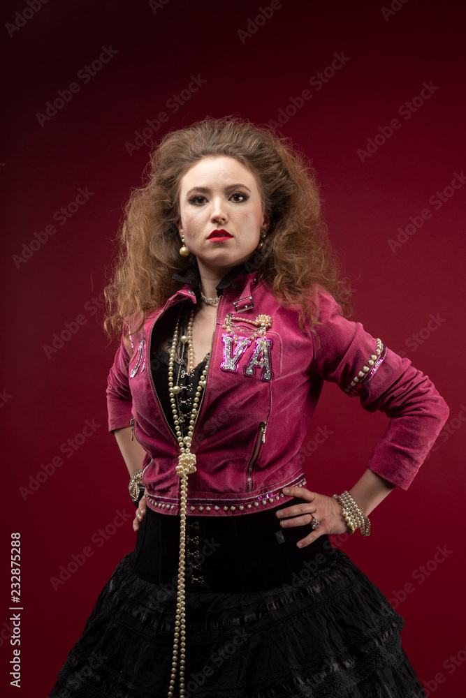 Girl 1980's style, red backdrop.